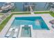 Luxury home showcasing a modern swimming pool and spa overlooking waterfront docks and boat lifts at 201 Punta Vista Dr, St Pete Beach, FL 33706