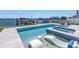 Stunning waterfront pool and spa with boat dock and bay views at 201 Punta Vista Dr, St Pete Beach, FL 33706