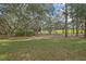 A wooded and grassy area featuring trees on a golf course at 2224 Vista Royal Way, Spring Hill, FL 34606