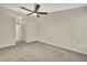 This neutral bedroom has carpeted floors and a ceiling fan and has a closet at 2224 Vista Royal Way, Spring Hill, FL 34606