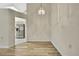 Dining room with wood-look floors and modern light fixture at 2224 Vista Royal Way, Spring Hill, FL 34606