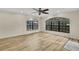 Bright living space boasts hardwood floors, large windows and a tranquil view at 2224 Vista Royal Way, Spring Hill, FL 34606