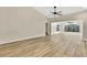 Bright living room features vaulted ceilings, light hardwood floors and neutral paint at 2224 Vista Royal Way, Spring Hill, FL 34606