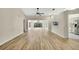 Spacious living room boasts vaulted ceilings, light hardwood floors, and an abundance of natural light at 2224 Vista Royal Way, Spring Hill, FL 34606