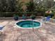 Inviting hot tub surrounded by lush landscaping and lounge chairs at 2413 Bayshore Blvd # 205, Tampa, FL 33629