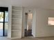 Bright interior featuring a bookcase, doorway, and a glimpse of a kitchen area at 2413 Bayshore Blvd # 205, Tampa, FL 33629