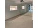 Spacious interior featuring large mirrors creating a sense of depth, and a serving hatch to the kitchen at 2413 Bayshore Blvd # 205, Tampa, FL 33629