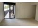 Carpeted living room with access to a balcony with seating at 2413 Bayshore Blvd # 205, Tampa, FL 33629