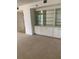 Bright living room with built-in shelving and neutral carpeting at 2413 Bayshore Blvd # 205, Tampa, FL 33629