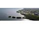 Breathtaking aerial view of a coastal community with stunning waterfront access and lush greenery at 2713 Via Murano # 216, Clearwater, FL 33764