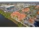 Aerial shot of a multi-story building next to office buildings, highway access and water views at 2713 Via Murano # 216, Clearwater, FL 33764