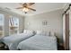 Bright bedroom with two beds, coastal decor, and natural light streaming through the windows at 2713 Via Murano # 216, Clearwater, FL 33764