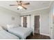 Comfortable bedroom with two beds, coastal decor, and a glimpse into the attached bathroom at 2713 Via Murano # 216, Clearwater, FL 33764