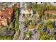 Aerial view of the community entrance, with lush landscaping, palms and a roundabout fountain at 2713 Via Murano # 216, Clearwater, FL 33764