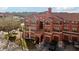 Multi-story building with a red tile roof, balconies, and private garages, showcasing the community's architecture at 2713 Via Murano # 216, Clearwater, FL 33764