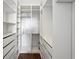 Organized walk-in closet featuring custom shelving, drawers, and hanging racks for optimal storage solutions at 2713 Via Murano # 216, Clearwater, FL 33764