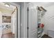 Walk-in closet with built-in shelving and rod for hanging clothes, accessible from the hallway at 2713 Via Murano # 216, Clearwater, FL 33764