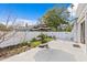 Private backyard with a concrete patio and white vinyl fence is ideal for outdoor living and entertaining at 2721 12Th N St, St Petersburg, FL 33704