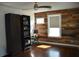 Bedroom featuring hardwood floors, a ceiling fan, and an accent wall at 2721 12Th N St, St Petersburg, FL 33704