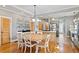 Open-concept dining room with modern lighting and hardwood floors at 2721 12Th N St, St Petersburg, FL 33704