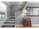 Light-filled entryway features hardwood floors, stairs, and a decorative side table at 2721 12Th N St, St Petersburg, FL 33704