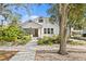 Charming home with mature landscaping, a covered porch, and a welcoming entrance at 2721 12Th N St, St Petersburg, FL 33704