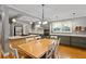 Bright, updated kitchen features stainless appliances, custom cabinetry, and a central island with cooktop and breakfast bar at 2721 12Th N St, St Petersburg, FL 33704