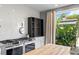 Well-lit kitchen with a stainless steel stove and plenty of cabinet space at 2721 12Th N St, St Petersburg, FL 33704