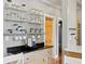 Kitchen detail showcasing open glass shelves and countertops with cabinetry at 2721 12Th N St, St Petersburg, FL 33704