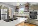 Modern kitchen with stainless steel appliances and quartz countertops at 2721 12Th N St, St Petersburg, FL 33704