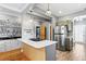 Contemporary kitchen showcasing stainless steel refrigerator and island gas range at 2721 12Th N St, St Petersburg, FL 33704