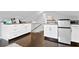 Cozy kitchenette with white cabinets, dark countertops, and stainless steel refrigerator at 2721 12Th N St, St Petersburg, FL 33704