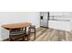 Kitchenette with white cabinets, granite countertops, stainless steel appliances, and wood-look floors at 2721 12Th N St, St Petersburg, FL 33704