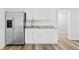 Bright kitchenette featuring stainless steel appliances, granite counters, and modern white cabinetry at 2721 12Th N St, St Petersburg, FL 33704