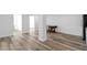 Open-concept living area boasts stylish wood-look floors and versatile space for dining and relaxation at 2721 12Th N St, St Petersburg, FL 33704