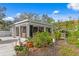 Bright sunroom featuring floor-to-ceiling windows and lush landscaping creates a serene indoor-outdoor space at 2721 12Th N St, St Petersburg, FL 33704