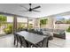 Bright sunroom features a dining area and a comfortable seating area at 2721 12Th N St, St Petersburg, FL 33704