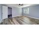 Bedroom with gray flooring, a neutral paint color and window at 3048 Holiday Lake Dr, Holiday, FL 34691