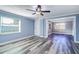 Bedroom features gray floors, natural light and neutral colored walls at 3048 Holiday Lake Dr, Holiday, FL 34691