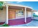 Inviting front entrance with detailed woodwork and a covered porch with support columns at 3048 Holiday Lake Dr, Holiday, FL 34691