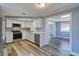 Updated kitchen with white cabinets, stainless steel appliances and easy access to living area at 3048 Holiday Lake Dr, Holiday, FL 34691