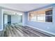 Inviting living room with hardwood floors, natural light from window, and calming wall color at 3048 Holiday Lake Dr, Holiday, FL 34691