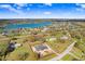 Aerial view of a new home construction in a lakeside community and defined property lines at 31049 Eloian Dr, Wesley Chapel, FL 33545