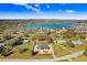 Aerial shot of new home construction in a lakeside community highlighting its location at 31049 Eloian Dr, Wesley Chapel, FL 33545