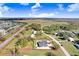 Expansive property showcasing a new home's location with mature trees and a clearly marked perimeter on a sunny day at 31049 Eloian Dr, Wesley Chapel, FL 33545