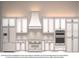 Modern kitchen design featuring white cabinets, stainless steel appliances, and a sleek range hood at 31049 Eloian Dr, Wesley Chapel, FL 33545