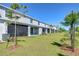 Backyard of home with a well-maintained lawn and partial shade at 32960 Regent Canal St, Wesley Chapel, FL 33545