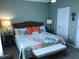 Bedroom showcasing a ceiling fan, decorative pillows, and side tables at 32960 Regent Canal St, Wesley Chapel, FL 33545