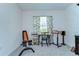 Spare bedroom setup for exercise or study with ample natural light and neutral walls at 32960 Regent Canal St, Wesley Chapel, FL 33545