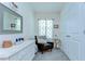Charming bedroom with white accents, an accent chair, and a decorative mirror at 32960 Regent Canal St, Wesley Chapel, FL 33545